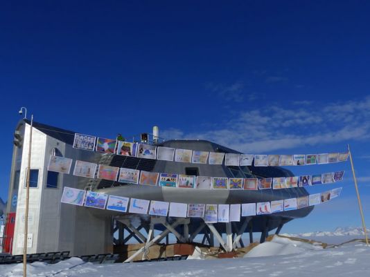 The drawings of the kids are waving in the wind at Princess Elisabeth Antarctica station.