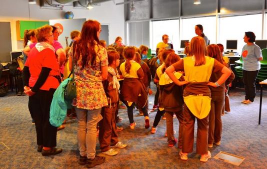 Brownies prepare to try on polar clothing - comparing clothing from Shackleton era 100 years ago and clothing worn by polar scientists today