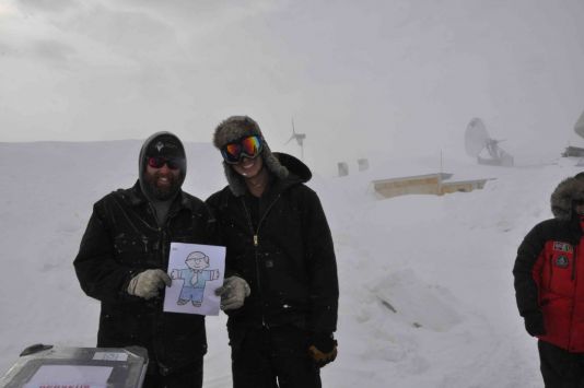 Flat Stanley with Ken Borek pilots at the Princess Elisabeth Station in a storm.