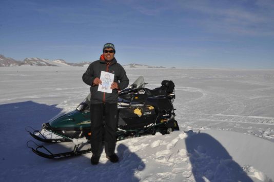 Flat Stanley rides a skidoo with Alain in the Sør Rondane Mountains.