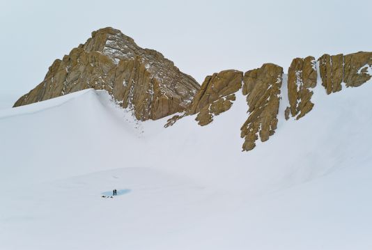 Jeroen Van Wichelen and Steve Roberts drill in a lake at Pinguinane to study its composition