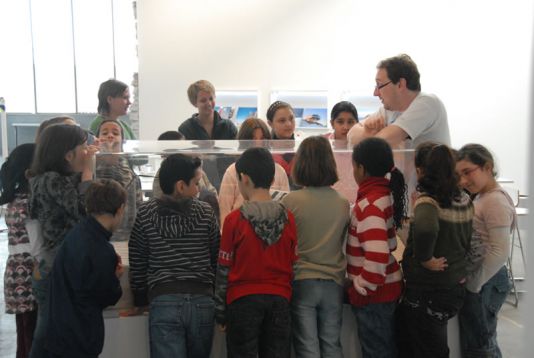 Polar Science corner: Group gathered around the Princess Elisabeth Station model.