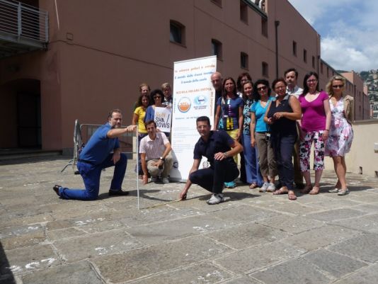 Carlo Ossola (1st left, coordinator of the summer school), and Matteo Cattadori (2nd left, coordinator of the educational activities), performing the SunShadows experiment with the teachers.